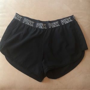 Pink swoosh gym shorts